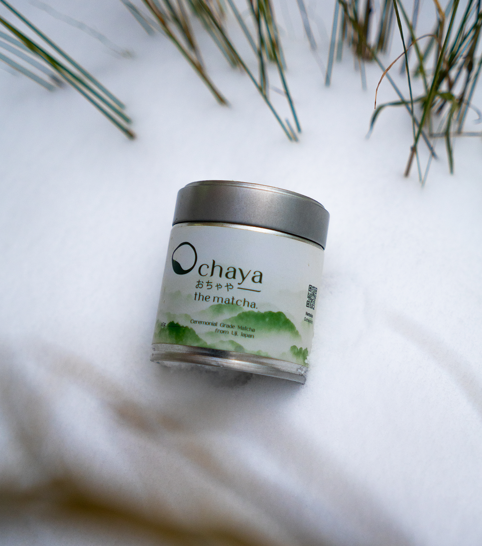Ochaya matcha container on a snowy background