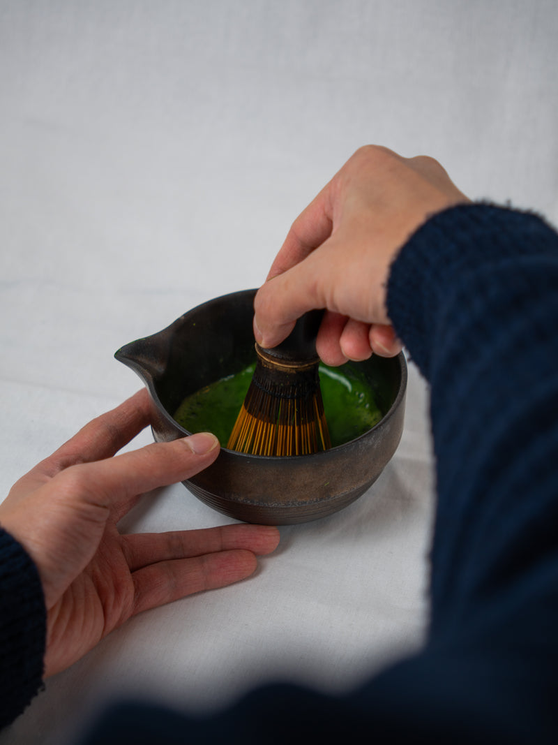 whisking matcha